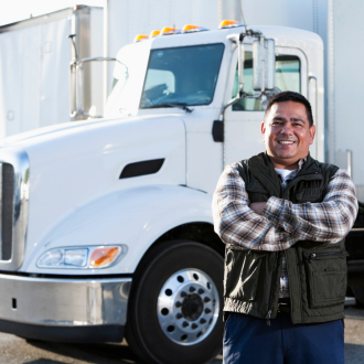 a truck driver in front of his truck