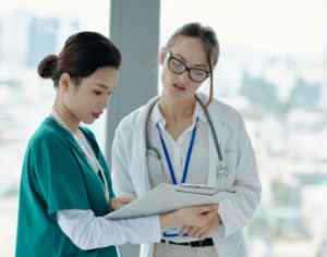 a doctor and a nurse discussing diagnosis