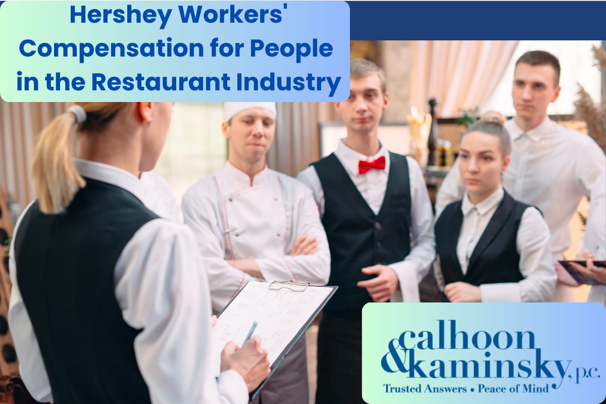 a team of restaurant workers discussing with each other